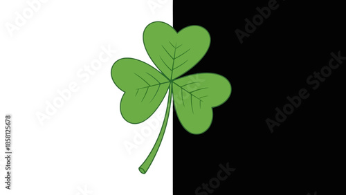 A flag divided vertically into white and black halves, with a green shamrock in the center.