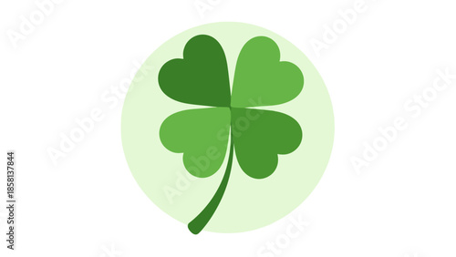 Four-leaf clover on a light green background, symbol of good luck.