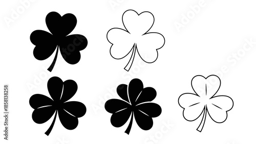 A collection of five shamrock icons, some filled in black and others outlined in white, representing St. Patrick's Day.
