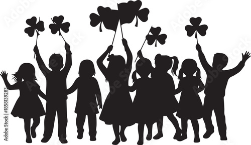 Children holding shamrocks in silhouette celebrating st patricks day
