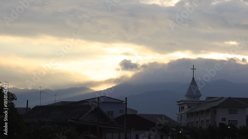 This waterfront video view in a riverside community in Chanthaburi shows the lights and houses along the water, as well as a Christian church – a beautiful tourist attraction in Thailand.