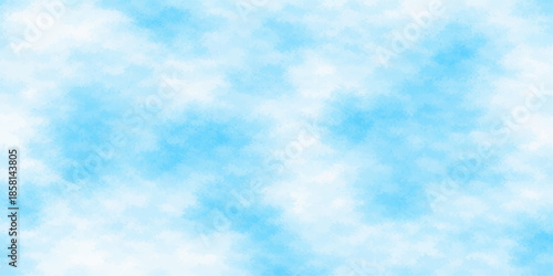 Beautiful blue sky background with white fluffy cumulus clouds on a bright sunny summer day featuring natural clear light and a beautiful atmosphere