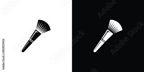 Two elegantly designed makeup brushes are presented in striking black and white reverse colors