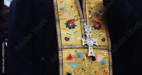 Details with the robe and cross of a christian orthodox priest.