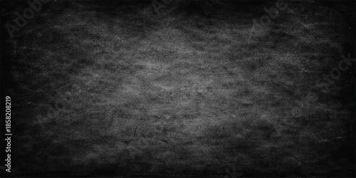 Dark grunge black and white textured background featuring an aged rough concrete wall pattern with a dirty vintage paper aesthetic suitable for a blank dark chalkboard backdrop or stone design