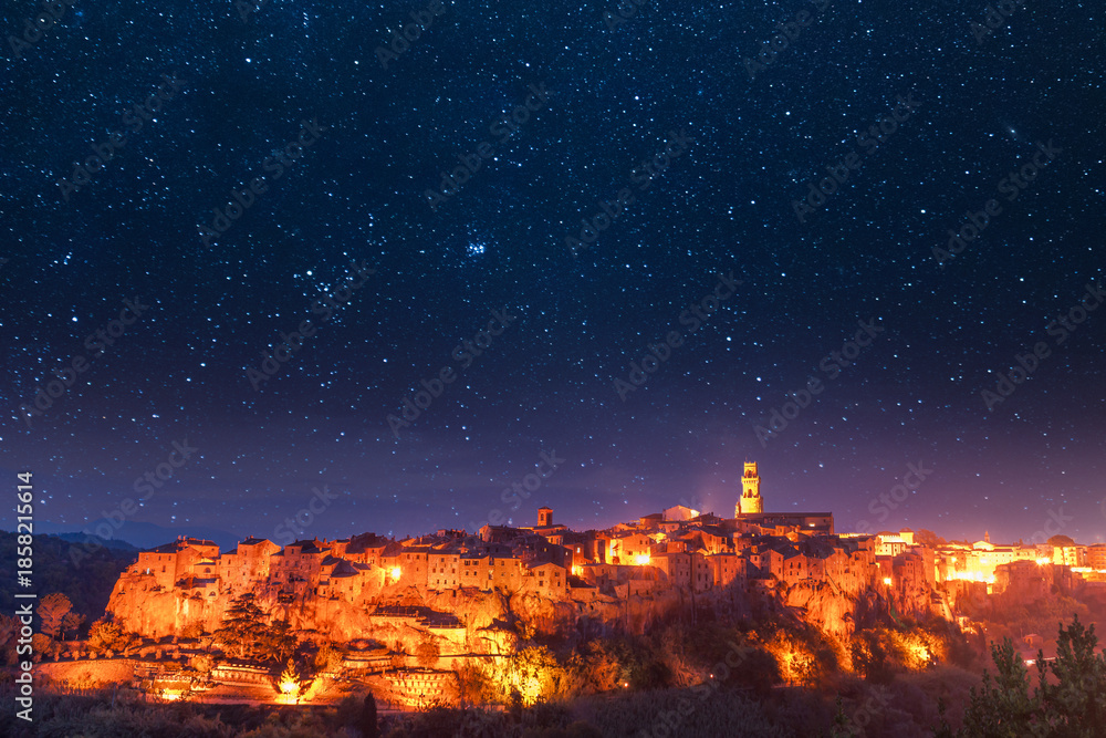 Fototapeta premium Italian Tuscany ancient Etruscan town of Pitigliano at stars night and light of lanterns