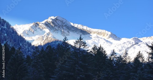  White snow-capped peaks on the Dolomites.