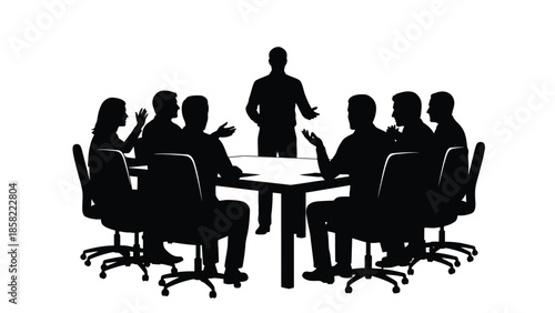 A group of people silhouetted around a conference table in a meeting