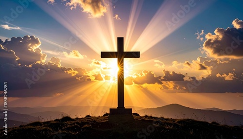 Cross on hill at sunrise. Religious symbol. Christian faith. Spirituality. Mountain landscape. Sunrise rays. Cloudy sky. Religious freedom day. World religion day. Inspirational scene. Hope