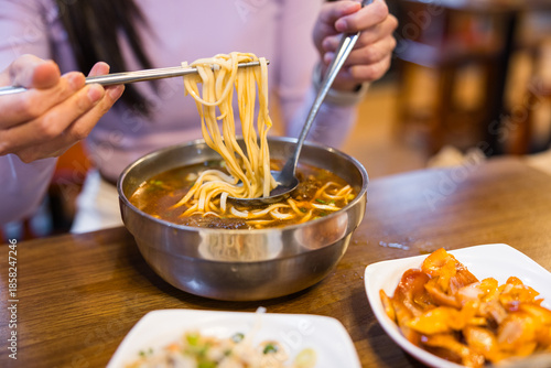 Wallpaper Mural Woman eating beef noodle soup at restaurant Torontodigital.ca