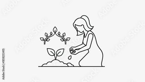 Woman planting a seedling in soil with care.