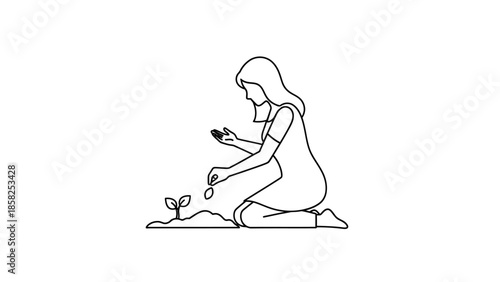 Woman planting a seedling in the soil.