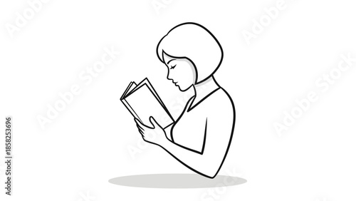 Woman engrossed in reading a book with focused expression.
