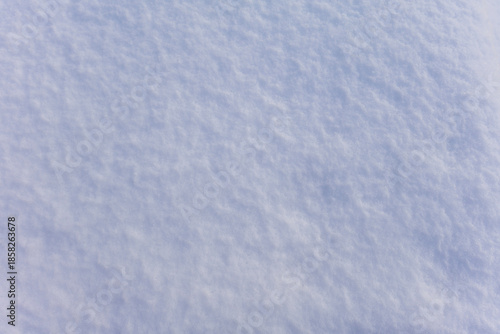 Fresh snow surface close up showing soft fluffy white texture details