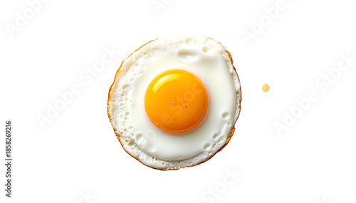 A perfectly fried egg with a bright yellow yolk, set against a stark black background