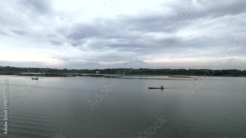 A Small Boat Navigating Through Water Hyacinth in Cengklik Lake, Aerial Waduk Cengklik 