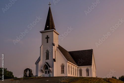 Golden hour light over The Church of the Assumption Roman Catholic Church in Avondale, NL