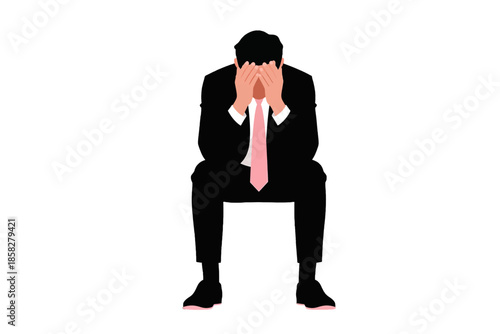 Man in dark suit covering face with hands