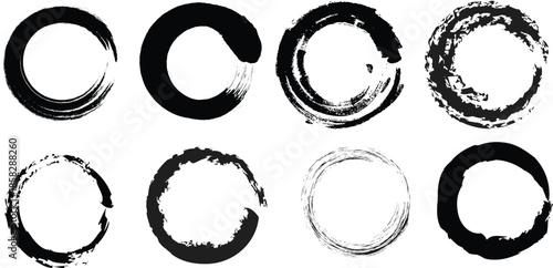 Set of black ink brush stroke zen enso circles with textured grunge borders isolated on white background