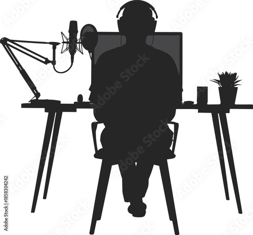 Black silhouette of a male content creator sitting at a desk with professional microphone, headphones, and computer, isolated on white.