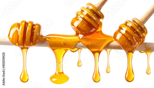 Close-up of honey dippers holding and dripping golden, thick liquid