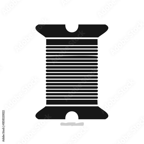 Black spool with thread wound around, crafts and sewing concept