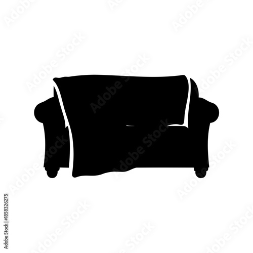 Silhouette of a comfortable couch draped with a cozy blanket or throw