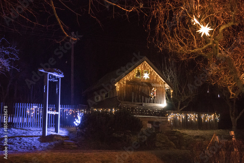 Magical Christmas village illuminated at night with festive lights