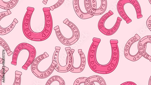 A seamless pattern of pink horseshoes adorned with small hearts, set against a light pink background.
