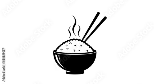 Steaming hot rice in a bowl with chopsticks