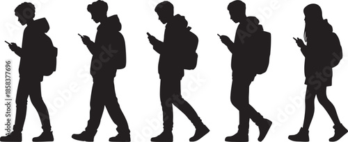 Five black silhouettes of young people walking and looking at smartphones vector