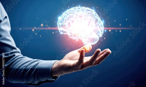 A person's hand holding a glowing brain with a blue background