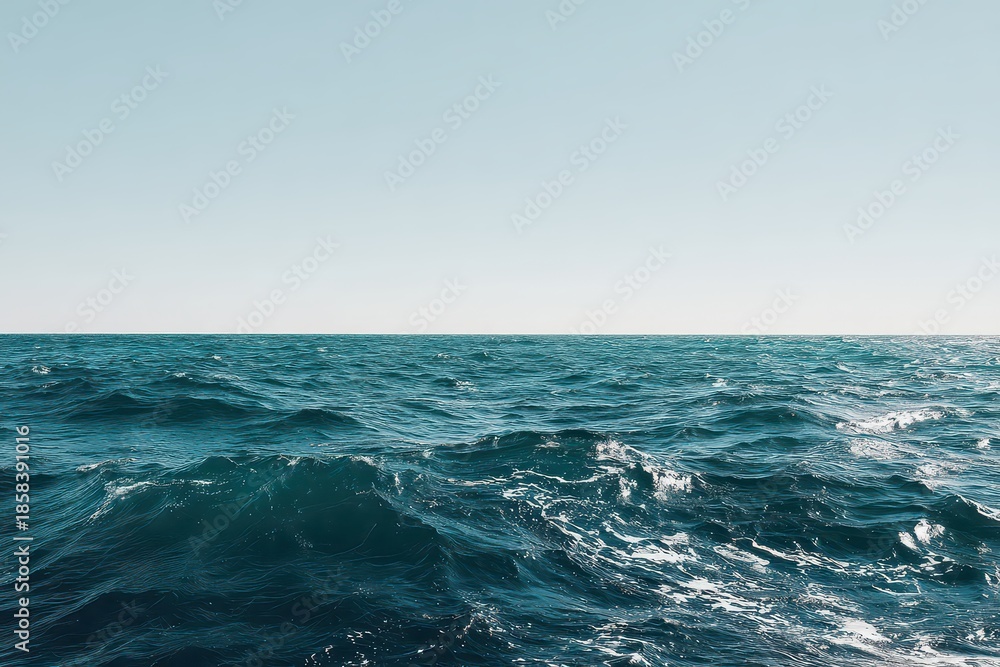Fototapeta premium Vibrant Blue Ocean Waters with Rolling Waves under a Clear Sky Reflecting Sunlight in an Open Water Landscape Scene during Bright Day