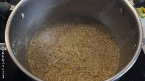 Wallpaper Mural Boiling pot of creamy grains on stovetop in kitchen Torontodigital.ca