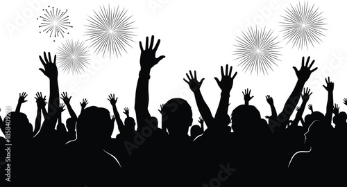 Silhouette of a cheering crowd with fireworks