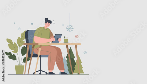 Stressed worker uses tablet during winter holiday season deadline anxiety