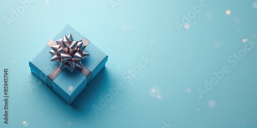 Wallpaper Mural Decorative gift box with a ribbon on a vibrant blue backdrop, suited for holiday messaging Torontodigital.ca