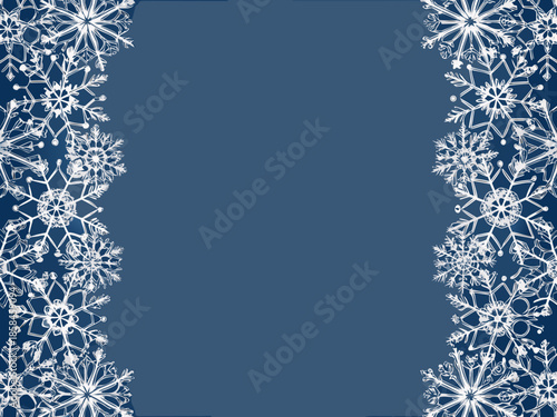 A winter scene with delicate white snowflakes framing a deep blue background