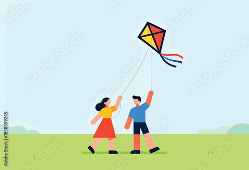 Children flying a colorful kite in a grassy field under a pale blue sky