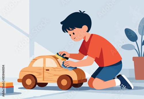 Young boy kneeling, cleaning a wooden toy car with a sponge and cloth
