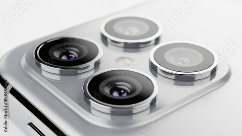 Smartphone Camera Technology: Close up of triple lens camera system on silver mobile phone for professional mobile photography
