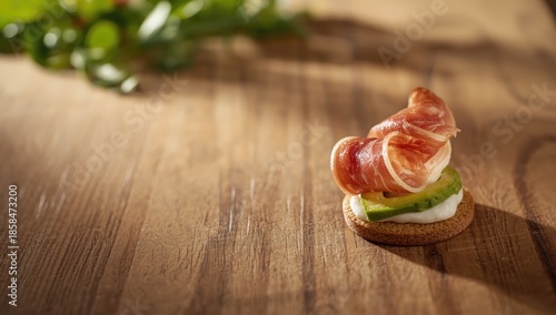 Sliced ham appetizer arranged with leafy greens to balance saltiness for buffet presentations