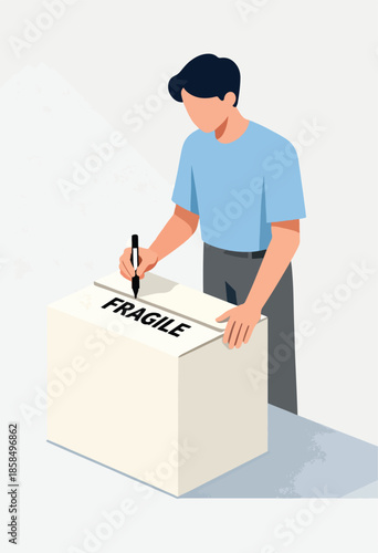 A person marks a cardboard box with the word "FRAGILE" using a marker