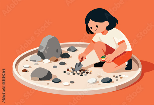Person tending a small zen garden with rocks, sand, and tiny plant