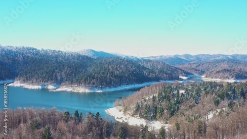 Beautiful winter panorama, Gorski kotar, Lokvarsko lake and Risnjak mountain in Croatia, frost on trees 