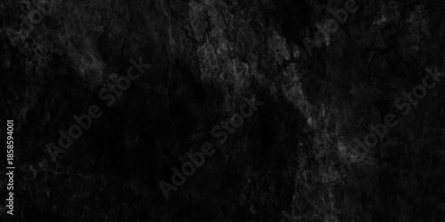 Dark black grunge background with textured stains and vignette wall effect, cement wall background in vintage style, black or dark gray rough grainy stone texture background, old gray wall background.