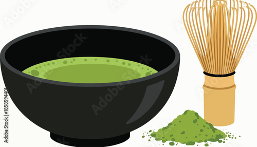 A black bowl of frothy green matcha tea sits next to a bamboo whisk and pile of powder