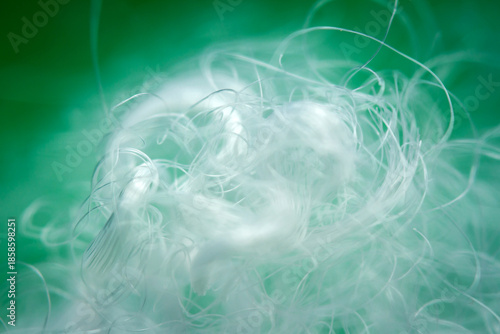 Photography Extreme macro of polyester stable fiber on green background