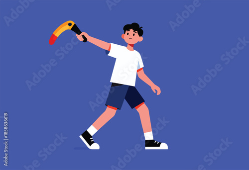 A young boy in casual clothes throws a boomerang with a toucan's beak design