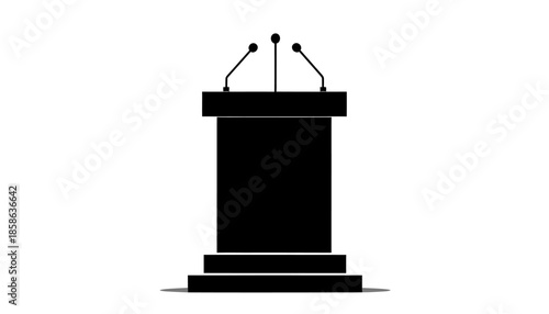 A black podium with three microphones on top, ready for a speech or presentation